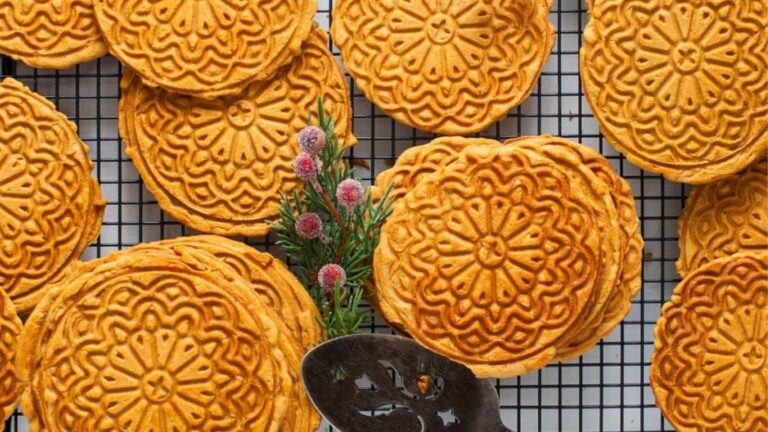 Chinese mooncakes on a cooling rack.