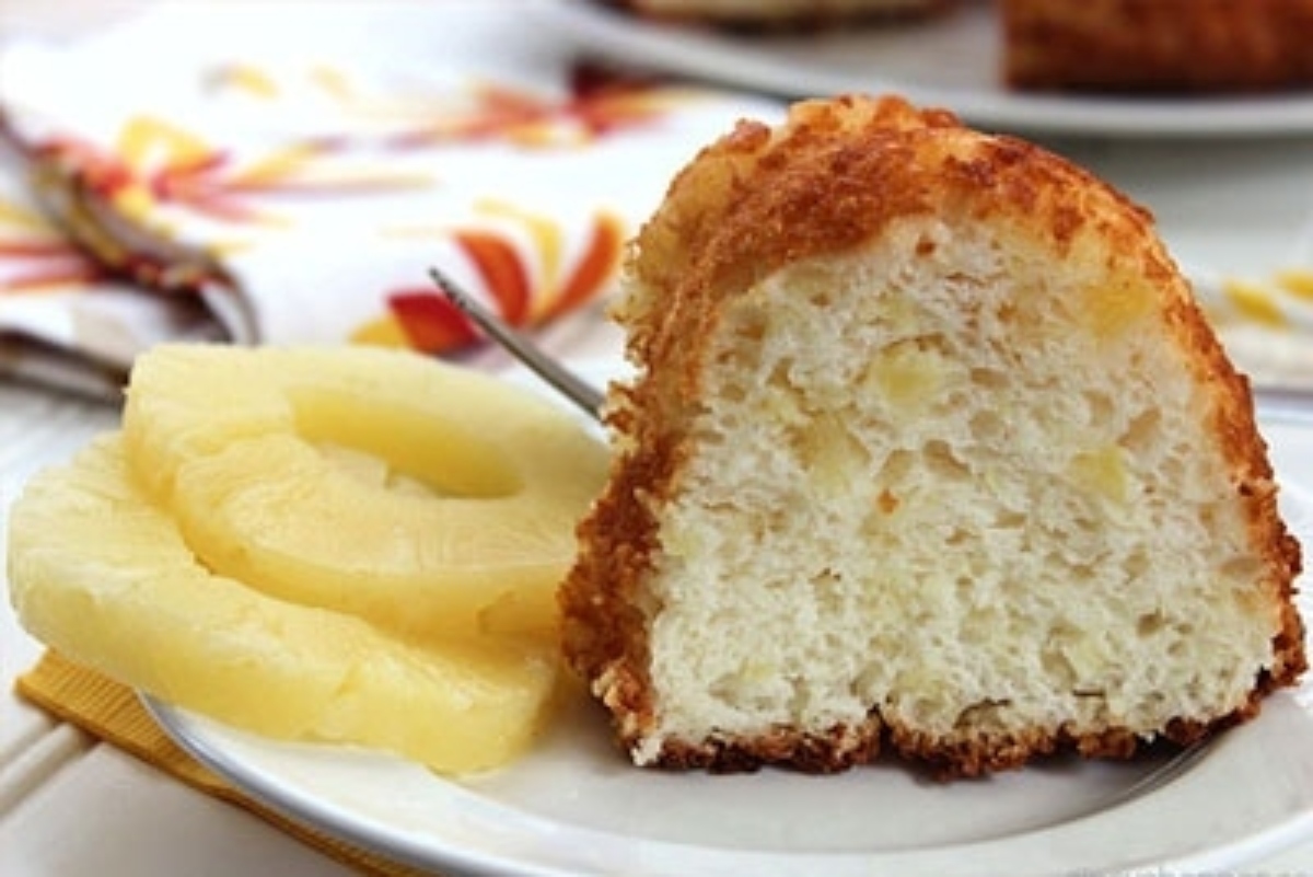 A slice of pineapple bundt cake on a plate.