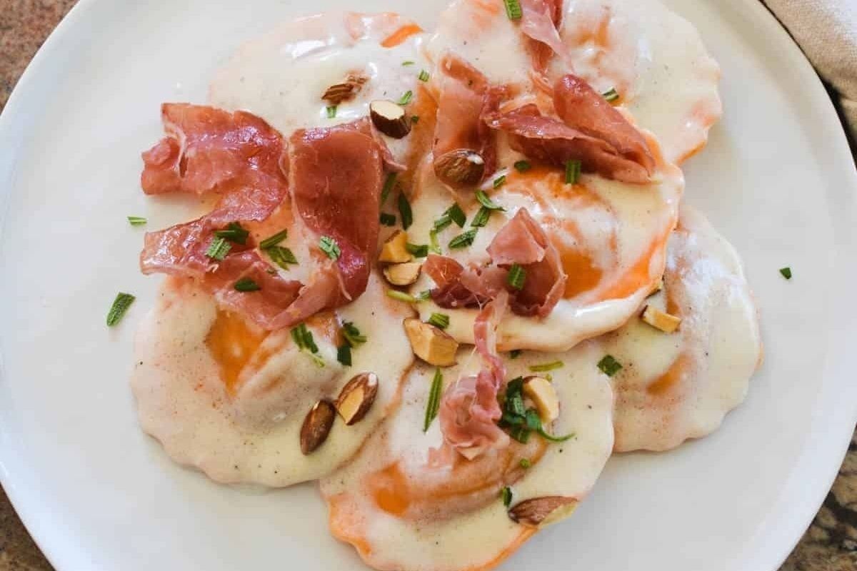 Butternut Squash Ravioli With Alfredo Sauce Prosciutto And Almonds