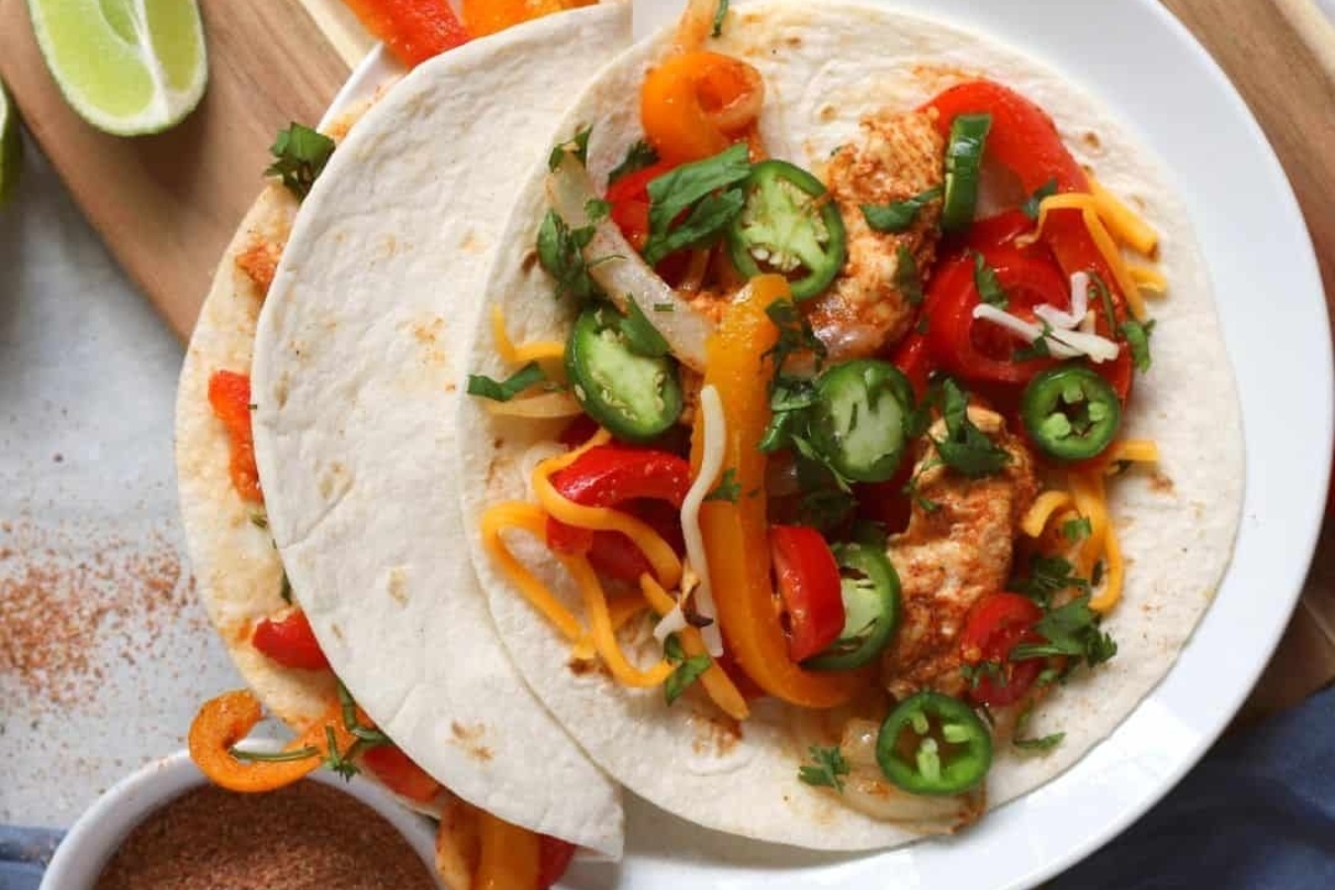 A plate of fajitas on a table.