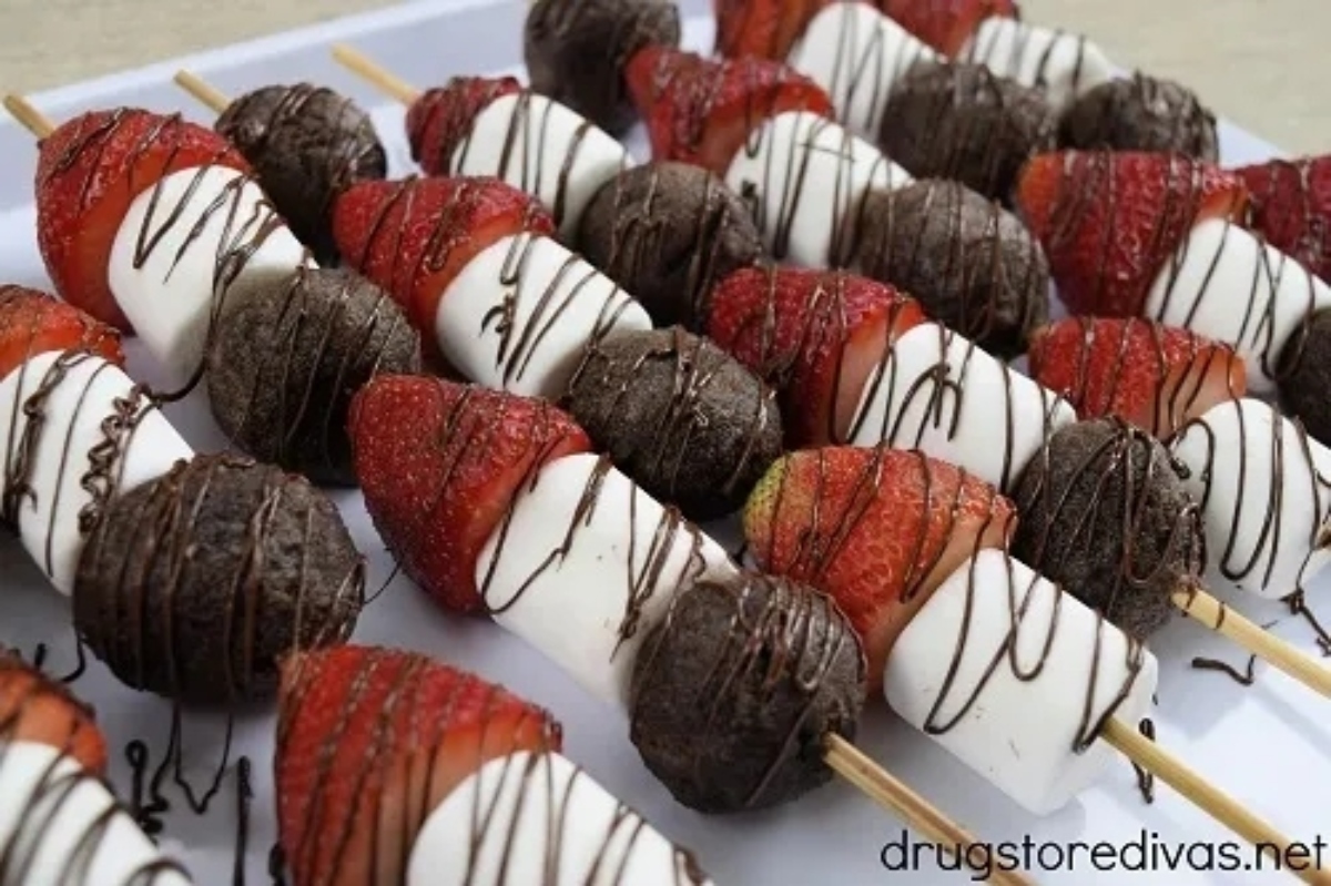 Chocolate dipped strawberries on skewers.