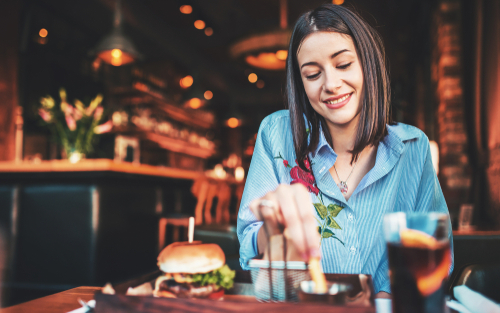 Girl eating at restaurant
