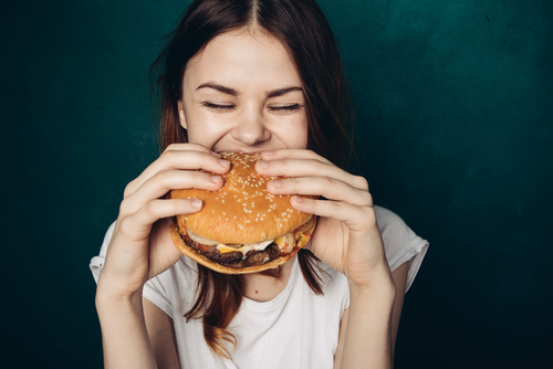 girl eating burger