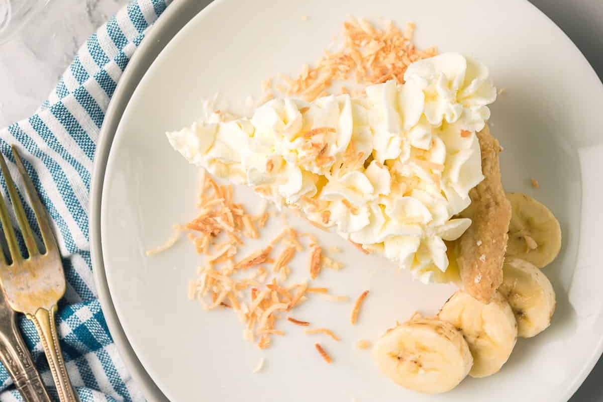 A slice of peanut butter banana pie on a plate.