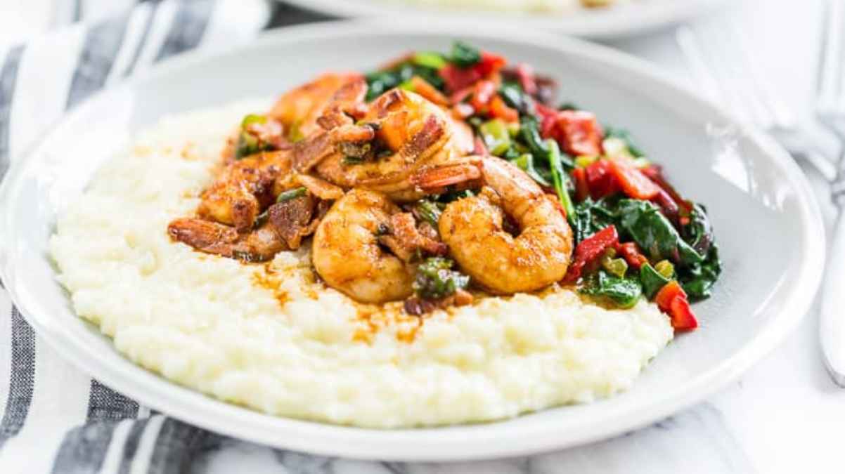 Cajun Shrimp and Cauliflower Grits with Greens. 