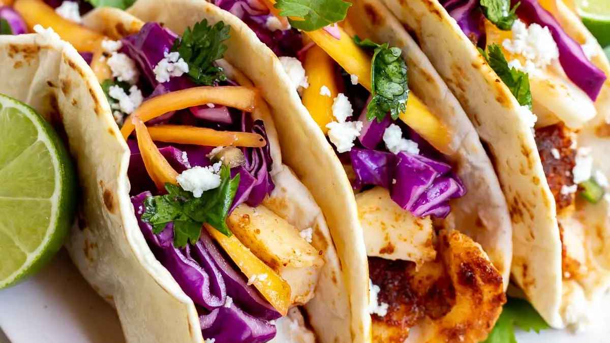 Easy Baked Fish Tacos with Mango Slaw. 