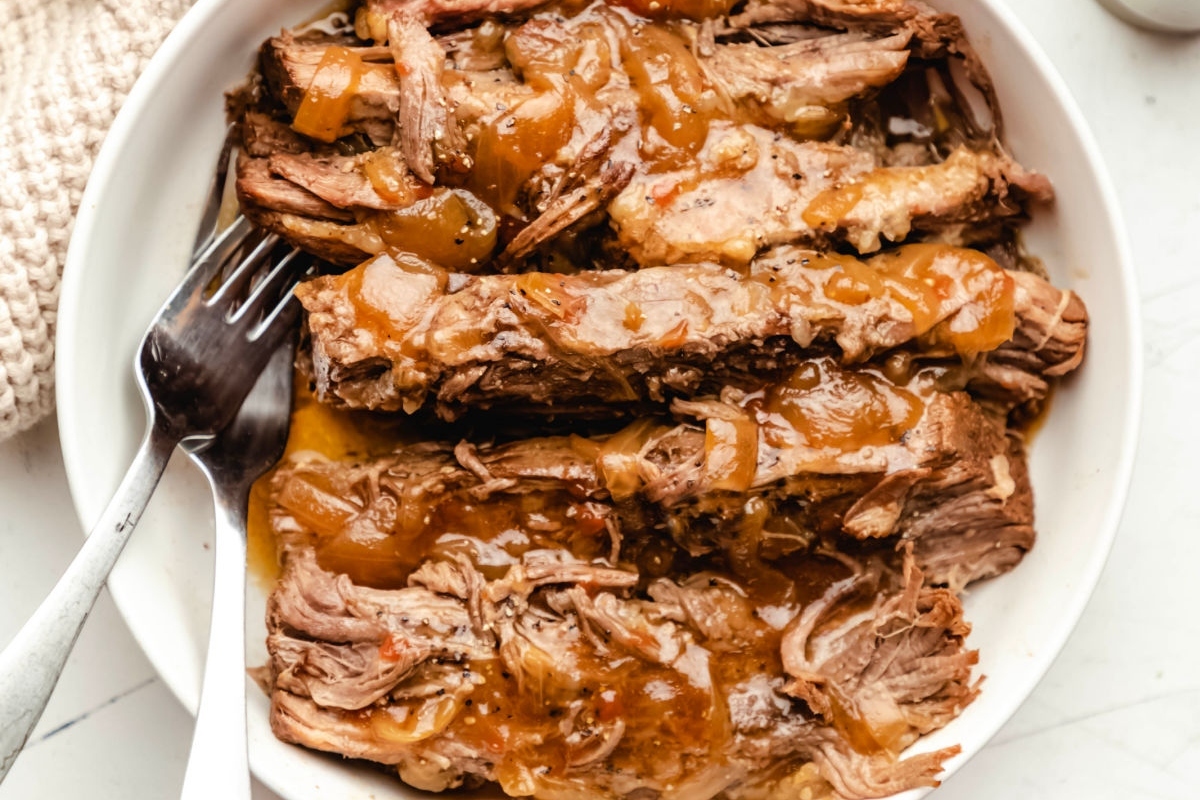 A dish of tender braised meat with gravy.