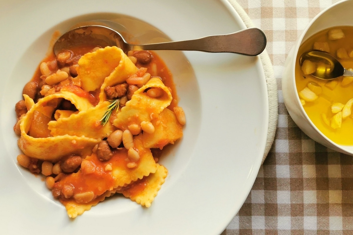 A plate of pasta with beans.