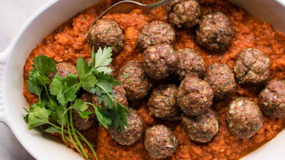 lamb meatballs with carrot tomato sauce.