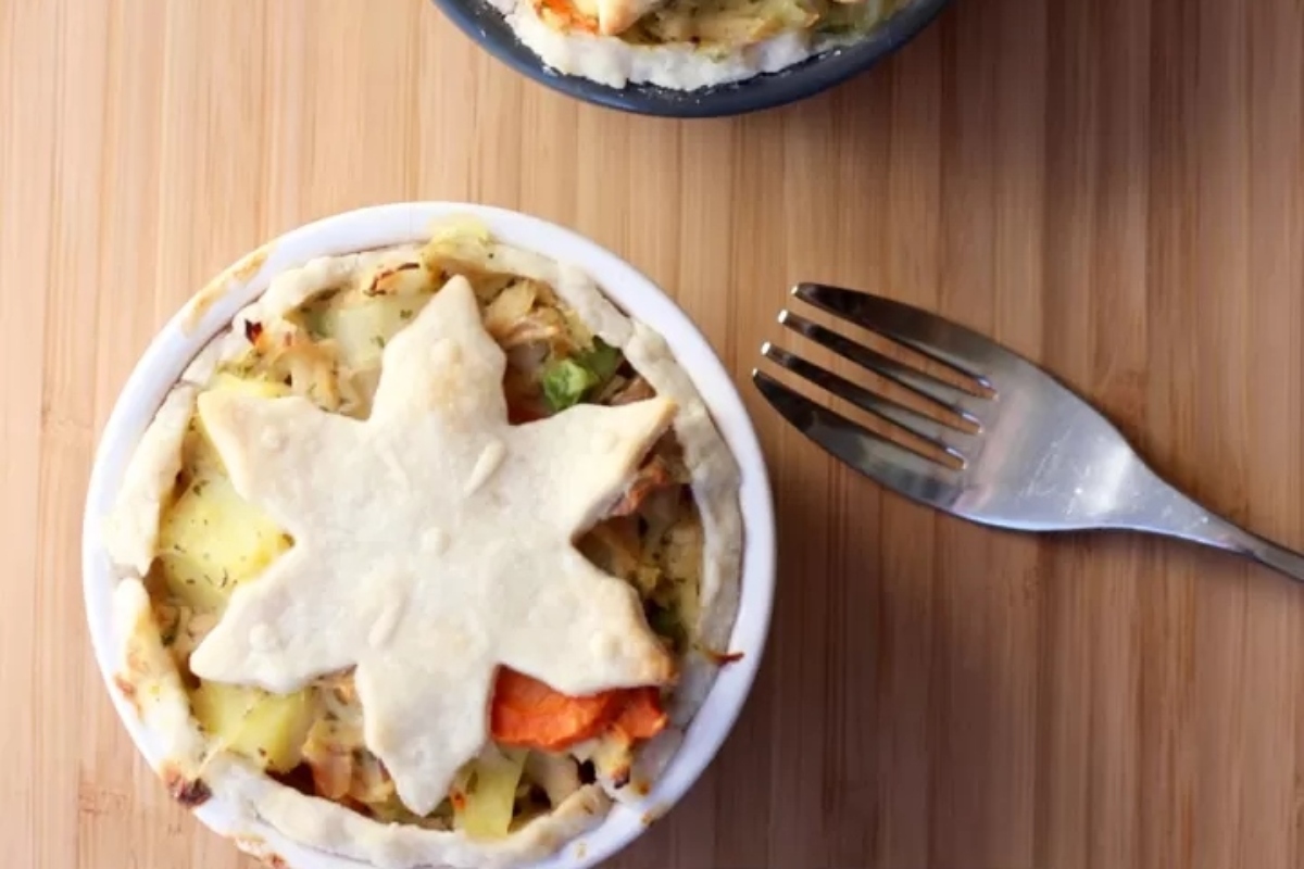 Two bowls of vegetable pot pie with a fork on top.