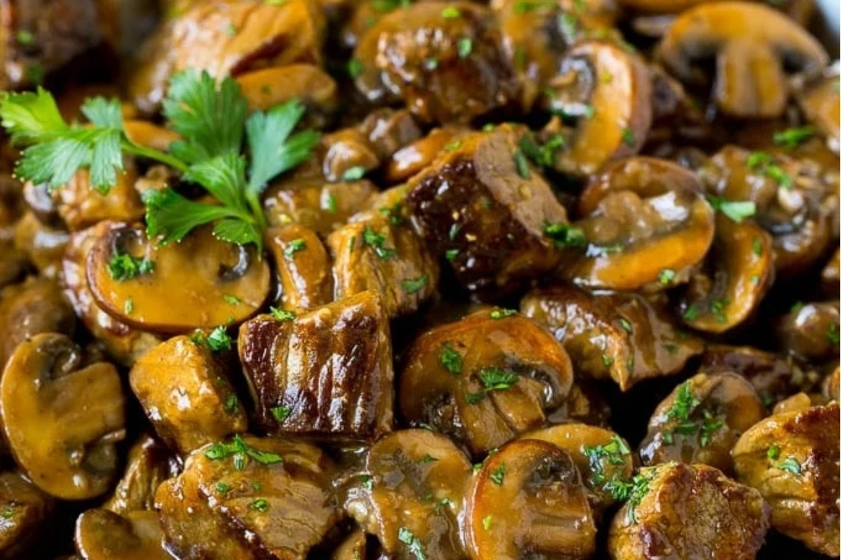Sautéed sliced mushrooms garnished with fresh parsley.