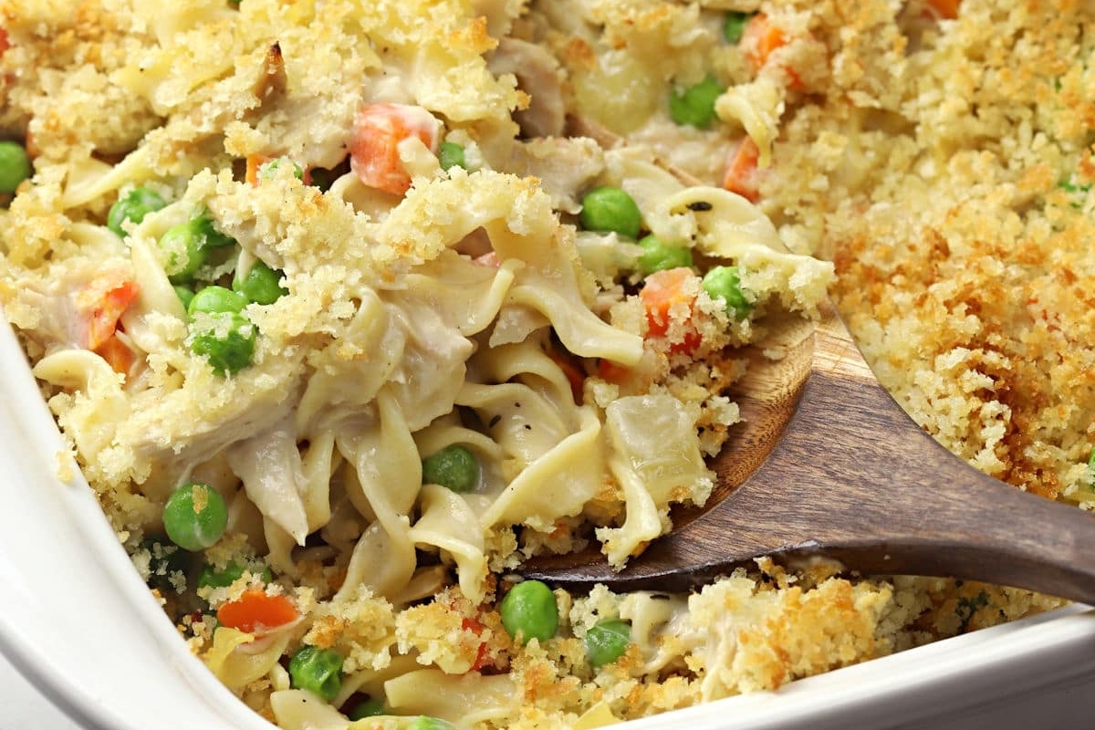 Chicken noodle casserole with peas and carrots.