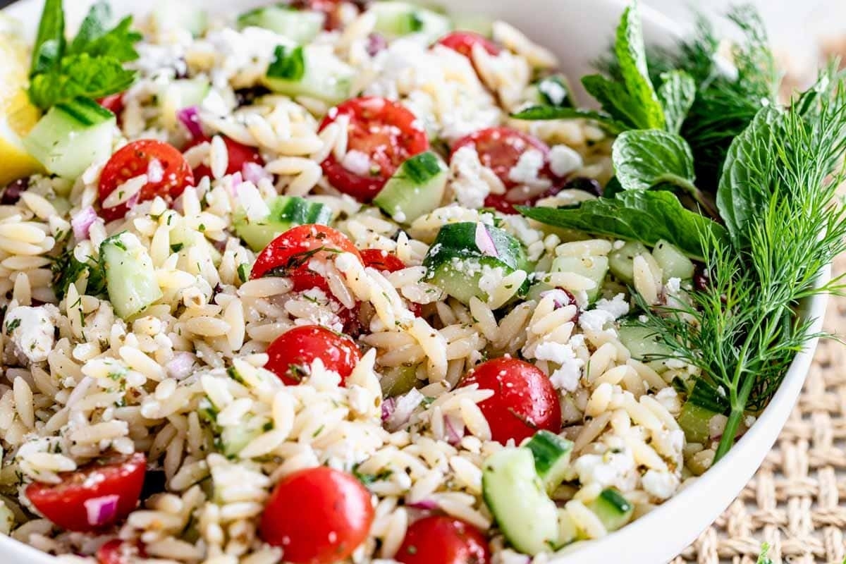 Greek orzo salad with tomatoes and cucumbers.