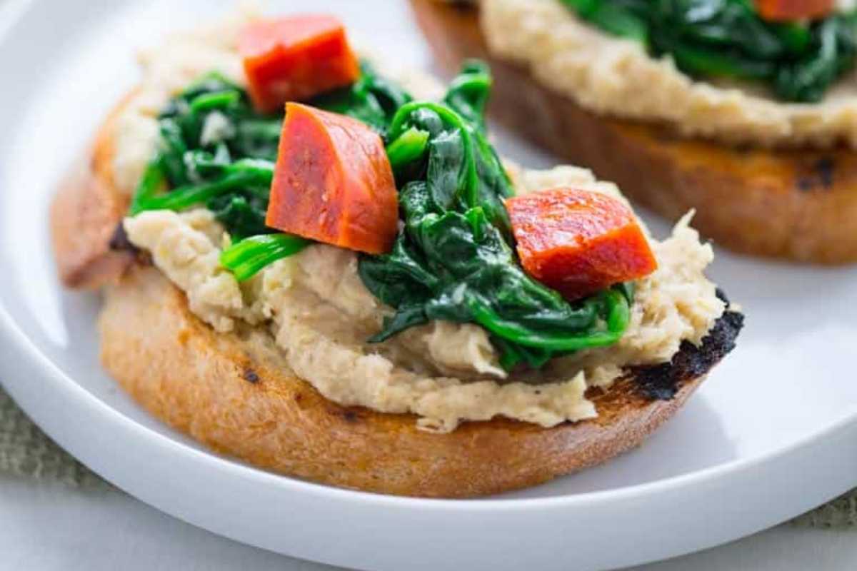 White Bean Bruschetta With Garlicky Greens. 