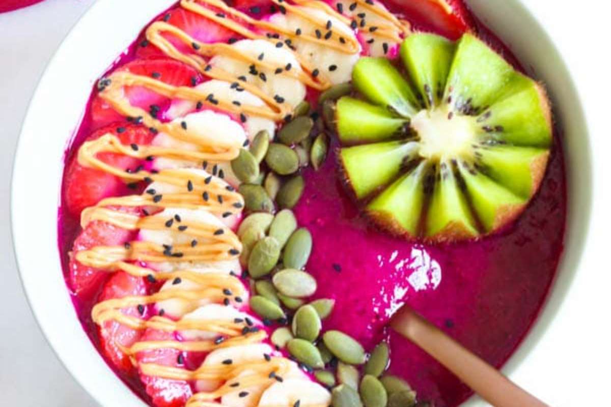 Dragon Fruit Smoothie Bowl With Seeds and Fresh Fruit Toppings. 