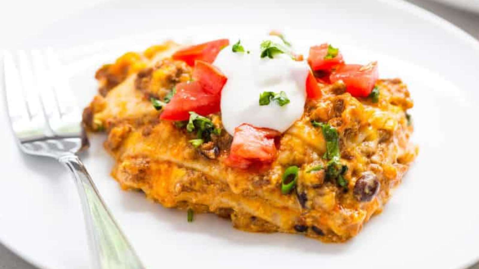 Easy Slow Cooker Taco Lasagna recipe by I Heart Naptime.