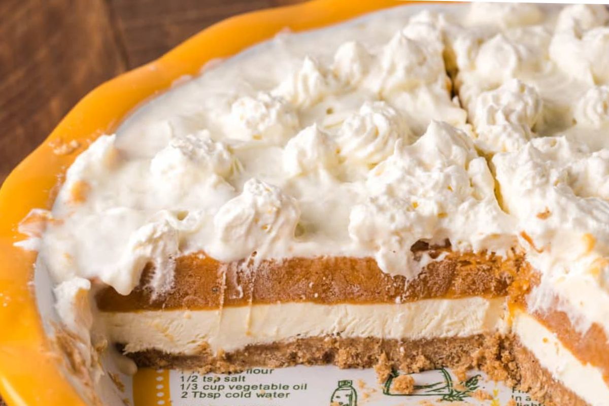 Pie plate full of pie with slice missing.