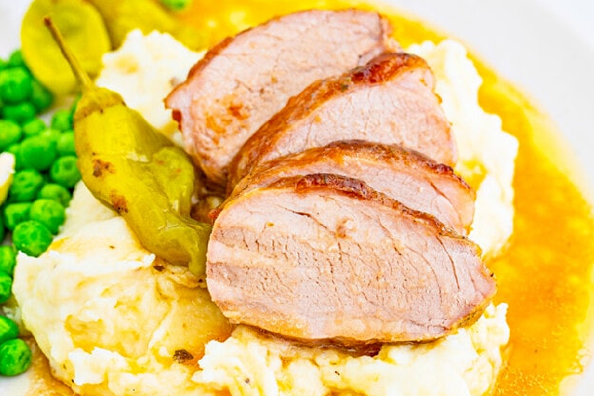 A plate of food with slow cooker recipes meat and mashed potatoes.