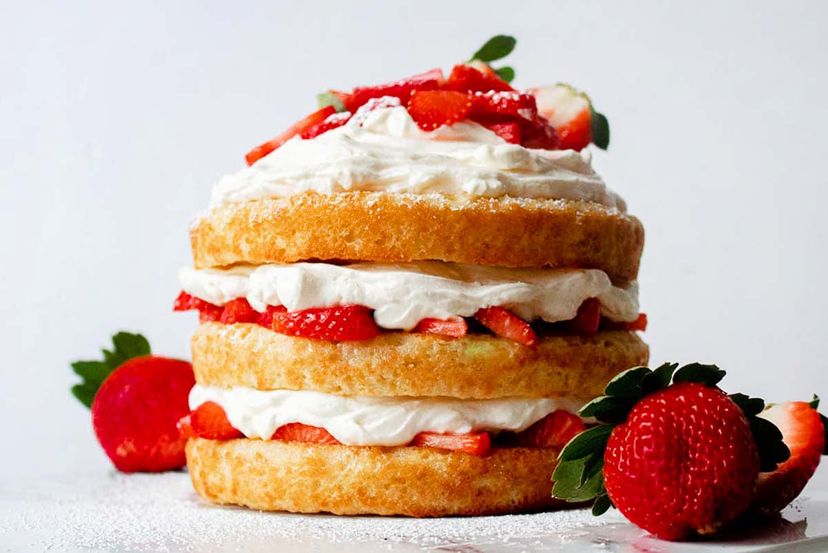 Vanilla Cake With Strawberries And Whipped Cream. 