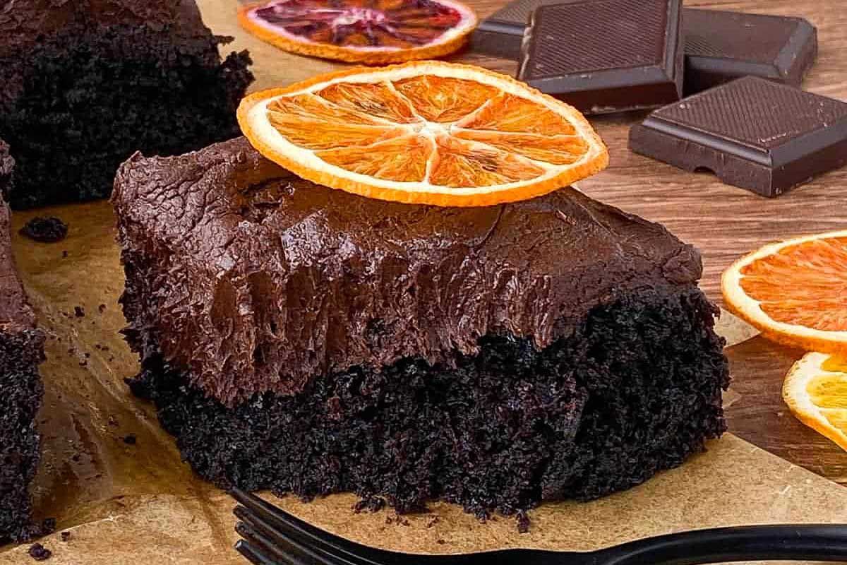 slice of chocolate orange cake with bite