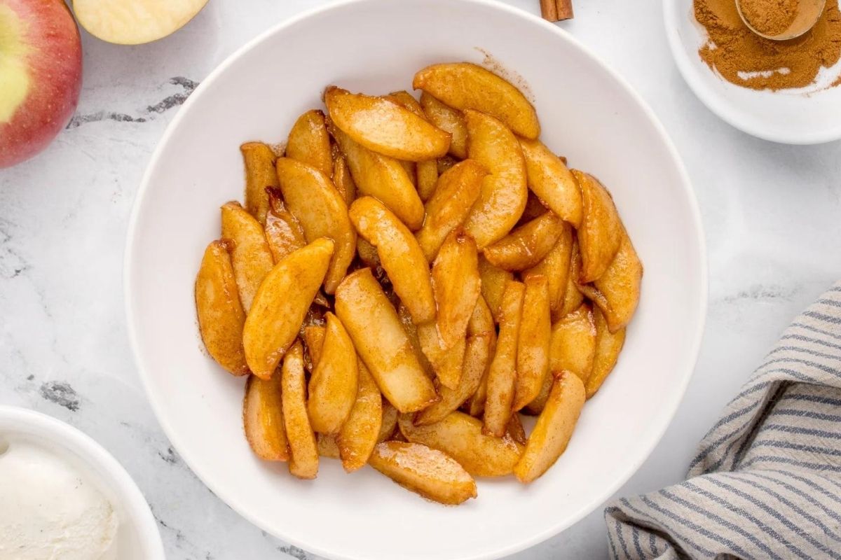 Apples on a white plate.