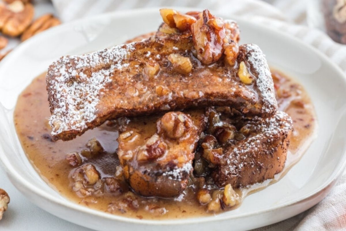 A pile of french toast sticks covered in our butter pecan syrup.