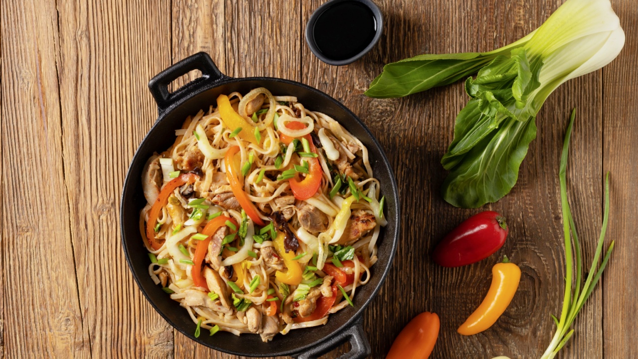 Pasta with chicken in oyster sauce prepared in a wok