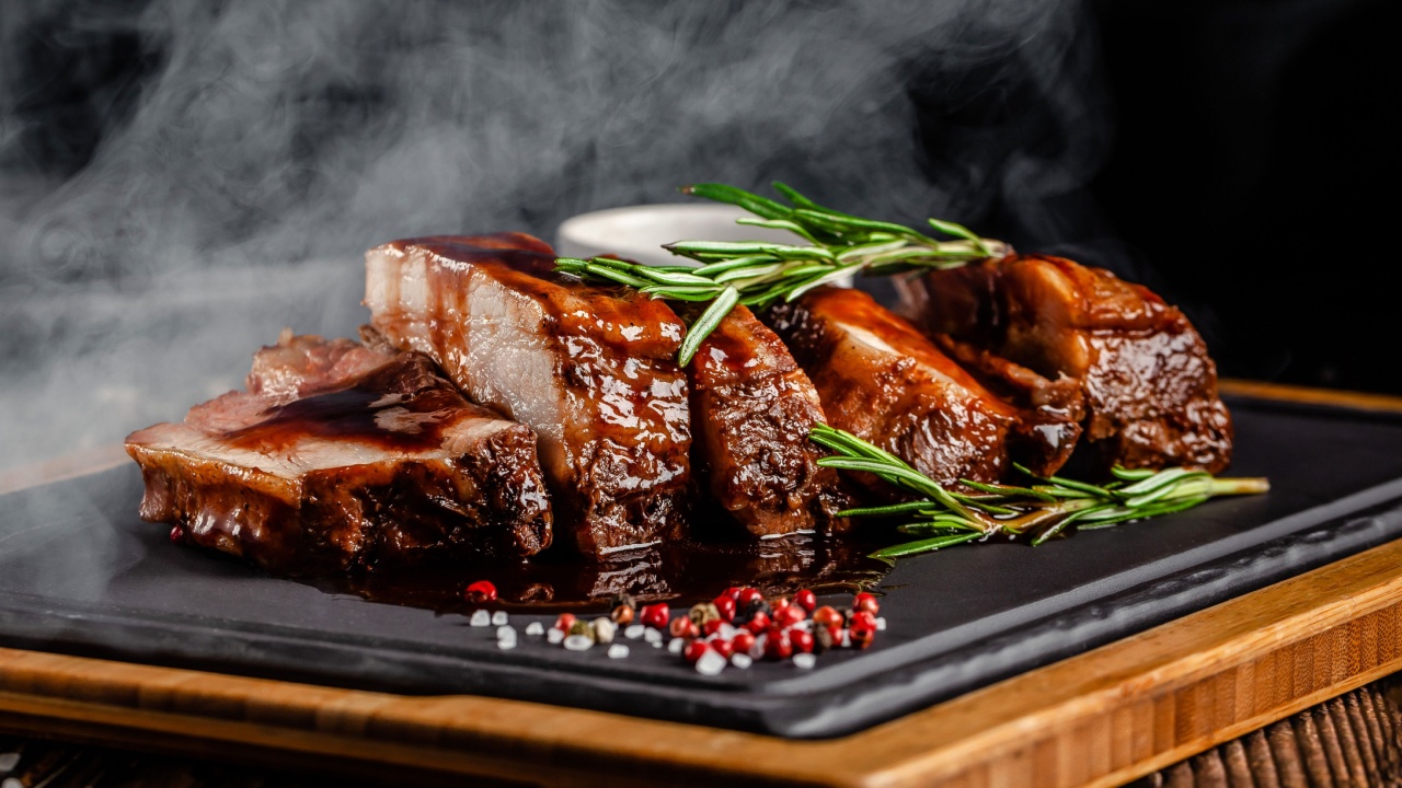 Grilled pork ribs with grilled sauce, with smoke, spices and rosemary