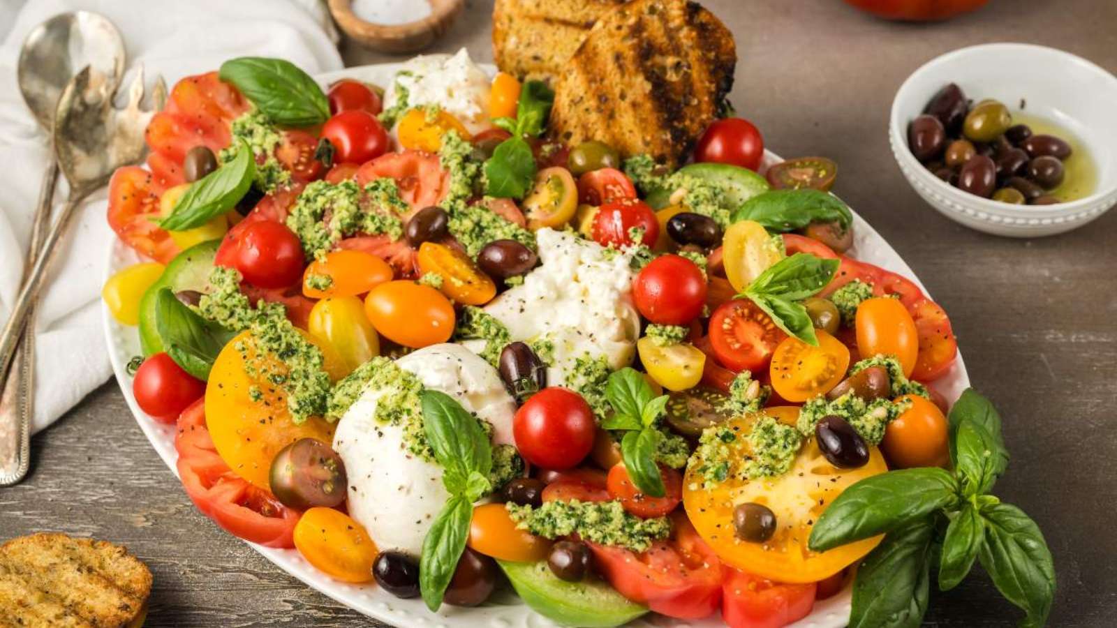 Burrata With Tomatoes And Pesto recipe by xoxoBella.