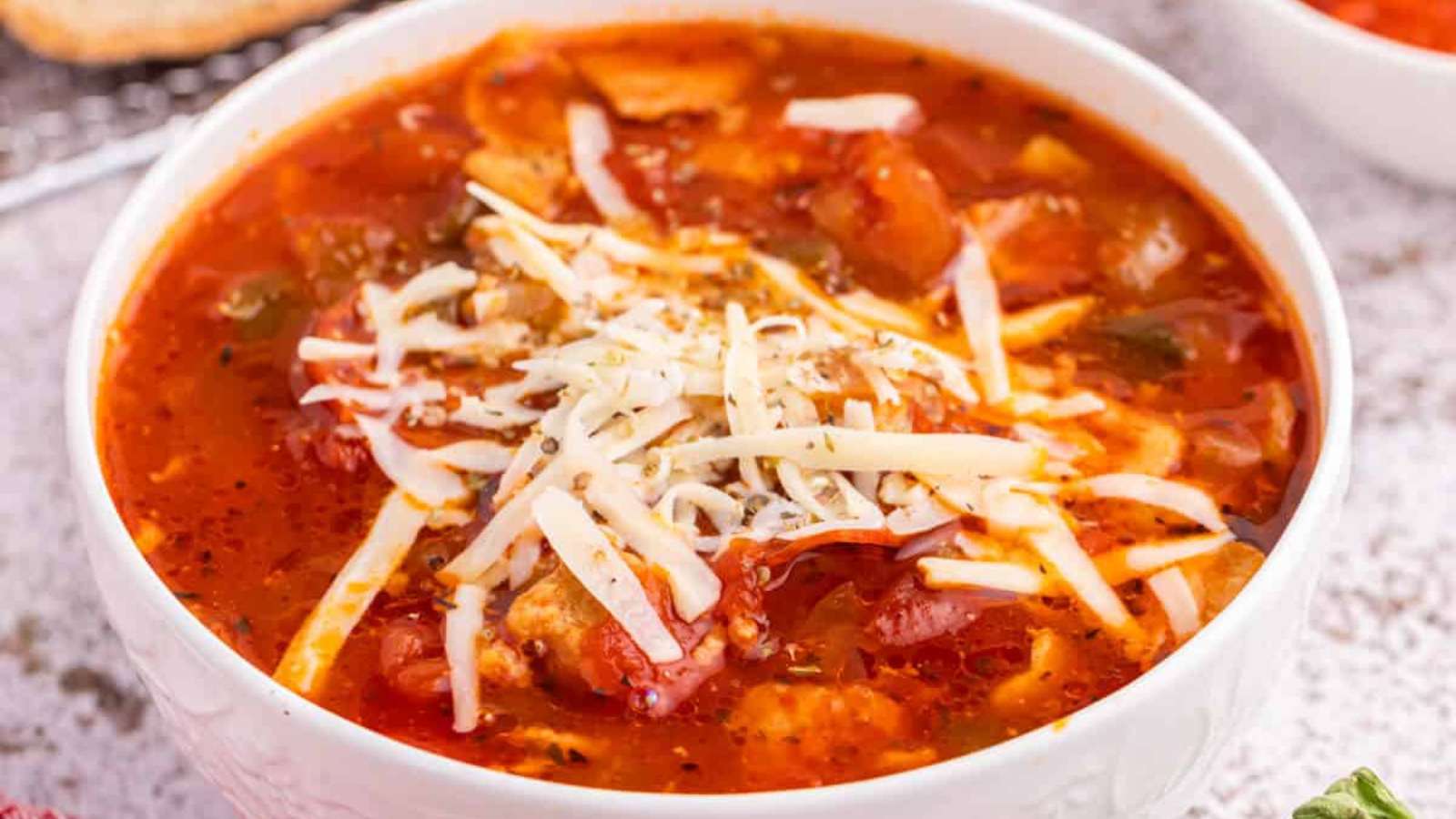 Easy Slow Cooker Pizza Soup recipe by Simply Stacie.