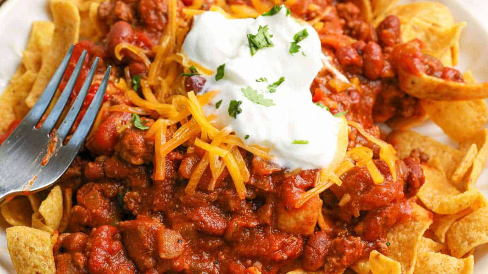 Slow Cooker Frito Chili Pie recipe by Simply Stacie.