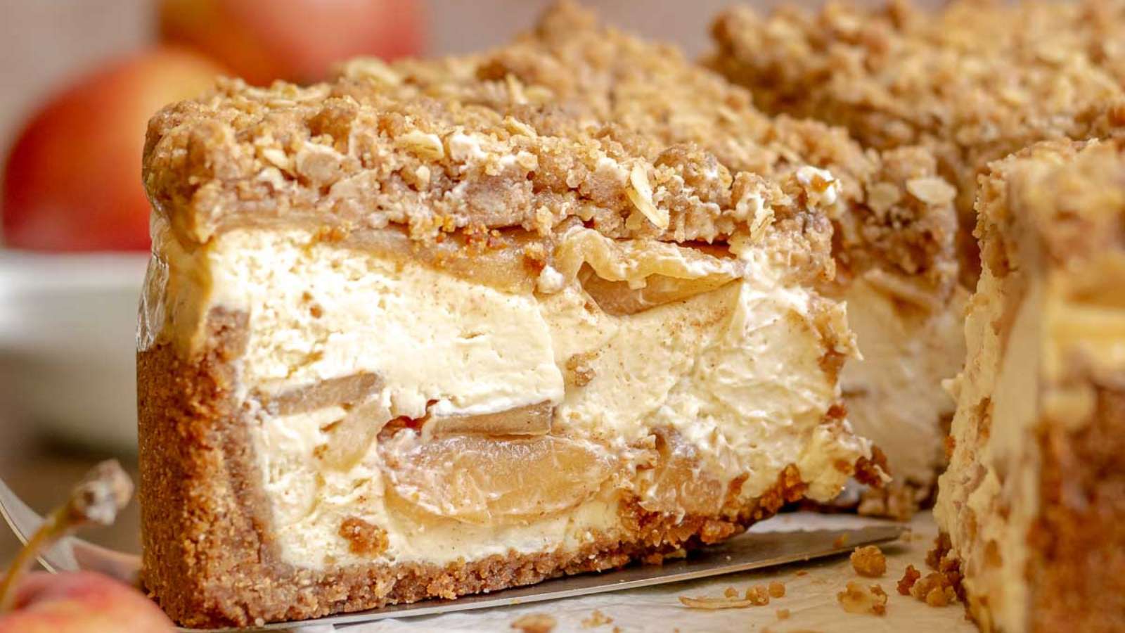 Apple Crumble Cheesecake recipe by The Cozy Plum.